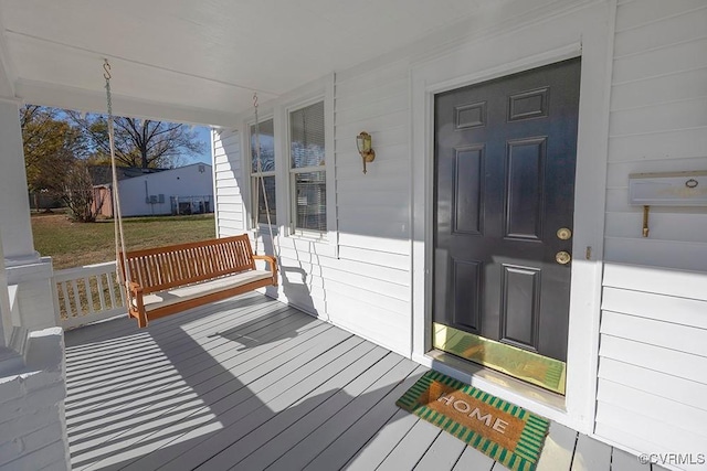 entrance to property featuring covered porch