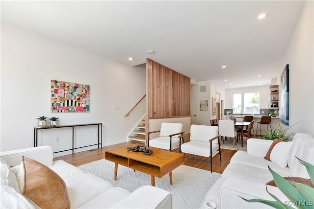 living room with light hardwood / wood-style flooring