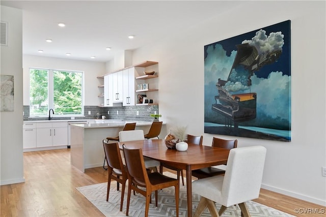 dining area with light hardwood / wood-style flooring