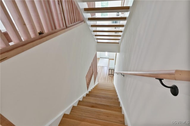 stairway with wood-type flooring