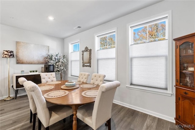 dining space featuring dark hardwood / wood-style flooring