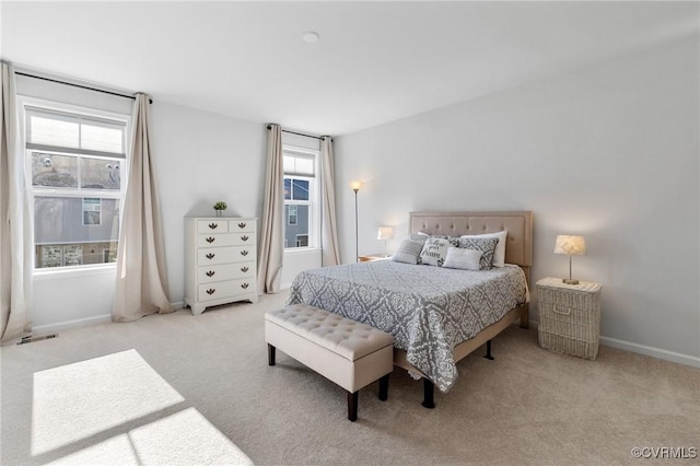 bedroom featuring light colored carpet