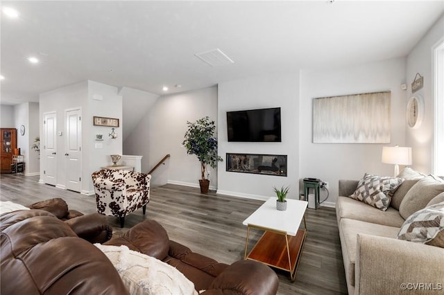 living room with dark hardwood / wood-style floors