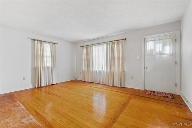 spare room with hardwood / wood-style floors