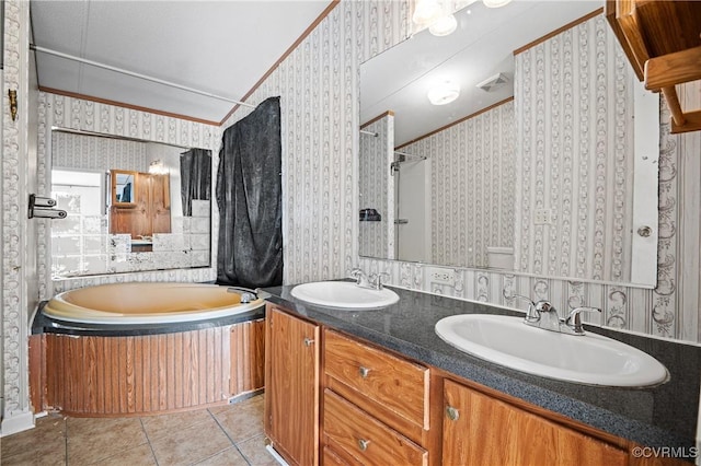 bathroom with tile patterned floors, vanity, ornamental molding, and independent shower and bath