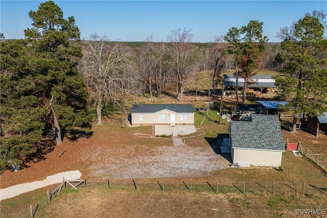 birds eye view of property with a rural view