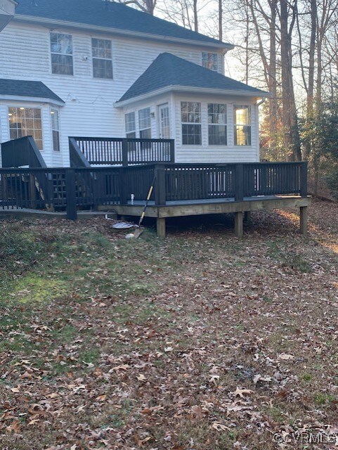 back of property with a deck