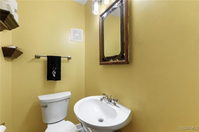 bathroom with sink and toilet