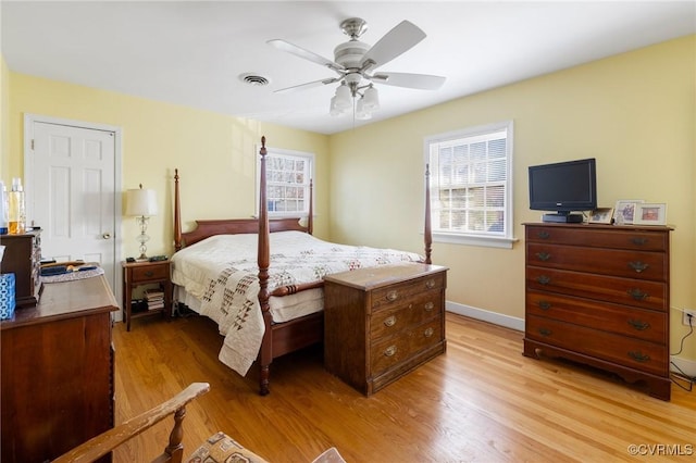 bedroom featuring light hardwood / wood-style flooring and ceiling fan