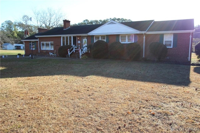 ranch-style house with a front lawn