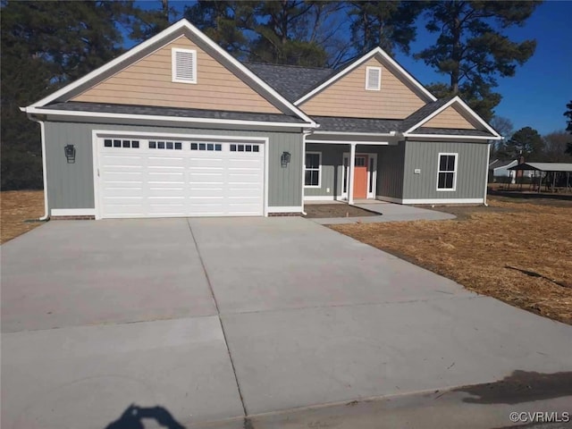 view of front of house with a garage and a porch