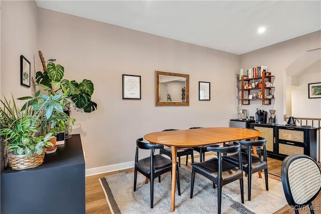 dining area with light hardwood / wood-style floors