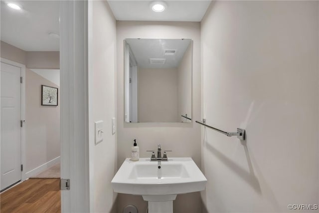 bathroom featuring hardwood / wood-style floors and sink