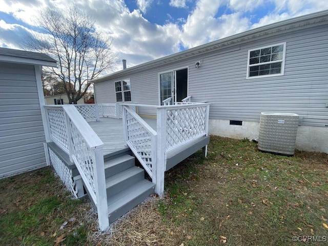 wooden deck featuring cooling unit