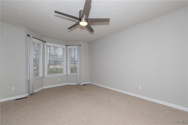 10710 Courthouse Rd, Dinwiddie, VA 23841 - empty room with a textured ceiling, light colored carpet, and ceiling fan