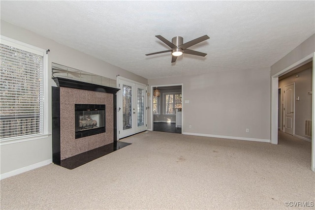 10710 Courthouse Rd, Dinwiddie, VA 23841 - unfurnished living room with ceiling fan, french doors, carpet, and a textured ceiling