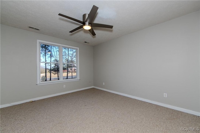 10710 Courthouse Rd, Dinwiddie, VA 23841 - empty room featuring carpet flooring, a textured ceiling, and ceiling fan
