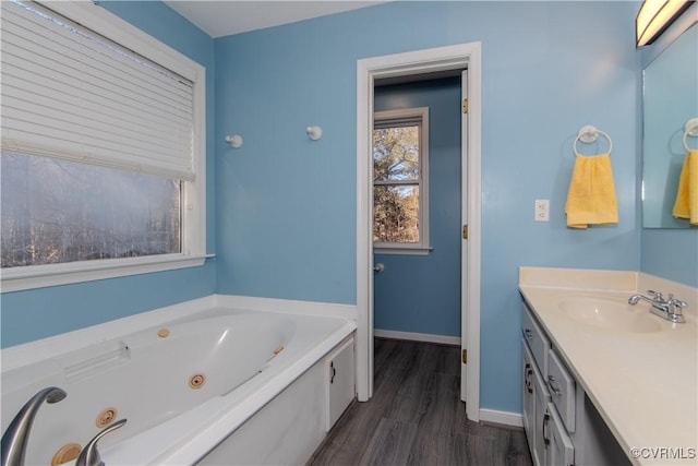 10710 Courthouse Rd, Dinwiddie, VA 23841 - bathroom featuring hardwood / wood-style floors, vanity, and a tub