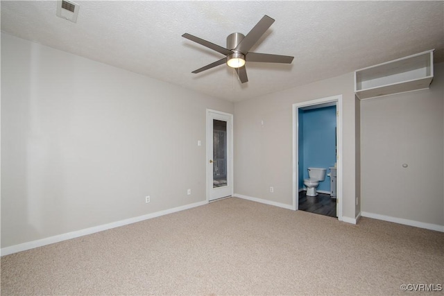 10710 Courthouse Rd, Dinwiddie, VA 23841 - unfurnished bedroom with carpet, a textured ceiling, connected bathroom, and ceiling fan
