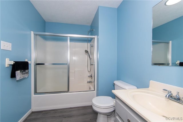 10710 Courthouse Rd, Dinwiddie, VA 23841 - full bathroom featuring enclosed tub / shower combo, wood-type flooring, a textured ceiling, toilet, and vanity