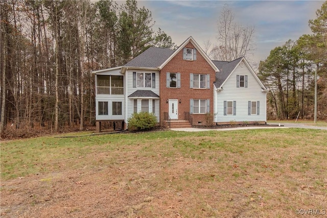 10710 Courthouse Rd, Dinwiddie, VA 23841 - view of front facade featuring a front lawn and a sunroom