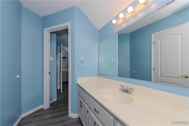 10710 Courthouse Rd, Dinwiddie, VA 23841 - bathroom with hardwood / wood-style floors, vanity, and a textured ceiling