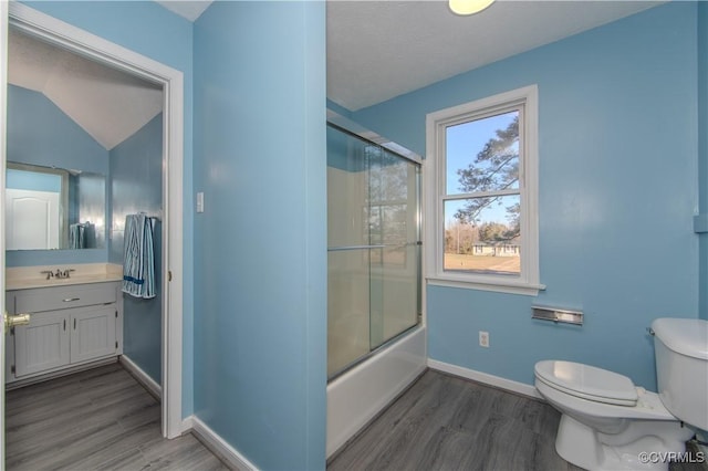 10710 Courthouse Rd, Dinwiddie, VA 23841 - full bathroom with shower / bath combination with glass door, hardwood / wood-style floors, lofted ceiling, and toilet