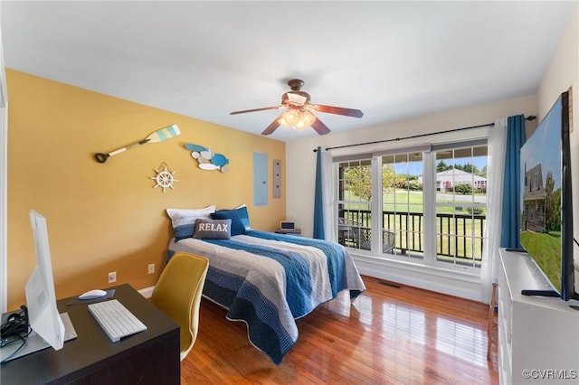 bedroom with ceiling fan and hardwood / wood-style floors