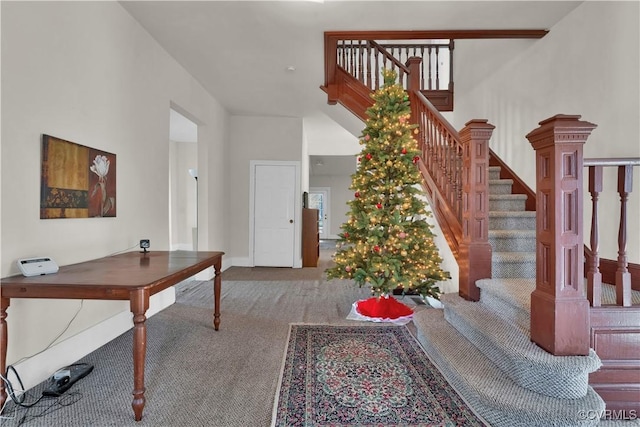 stairway featuring carpet flooring