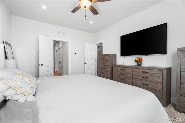 carpeted bedroom featuring ceiling fan