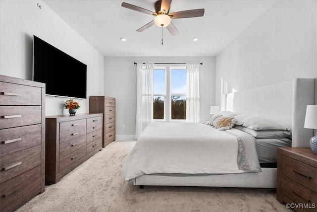 carpeted bedroom featuring ceiling fan