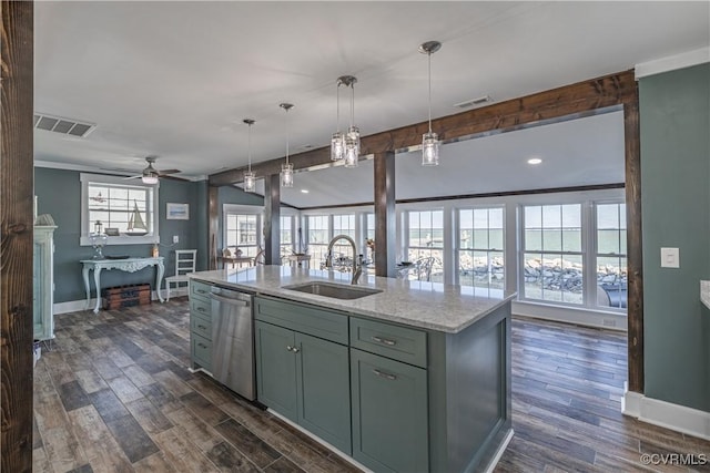 kitchen featuring sink, an island with sink, stainless steel dishwasher, and plenty of natural light