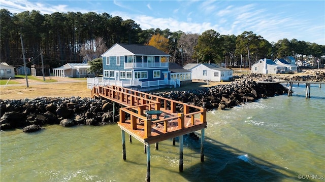 dock area featuring a deck with water view