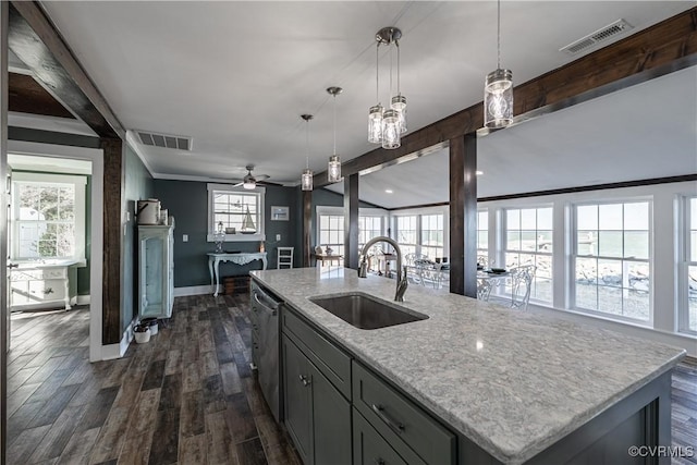 kitchen featuring ceiling fan, an island with sink, plenty of natural light, and sink