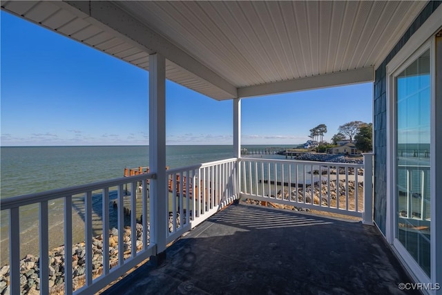 balcony featuring a water view