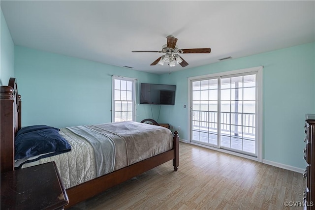 bedroom featuring access to outside, light hardwood / wood-style floors, and ceiling fan