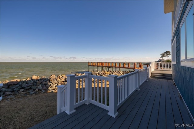 wooden deck featuring a water view