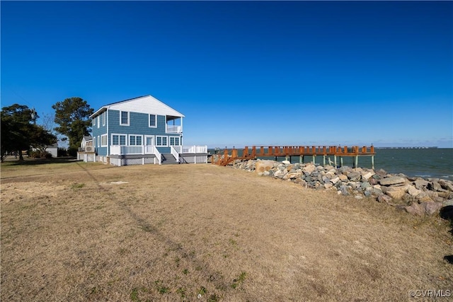 rear view of house with a water view