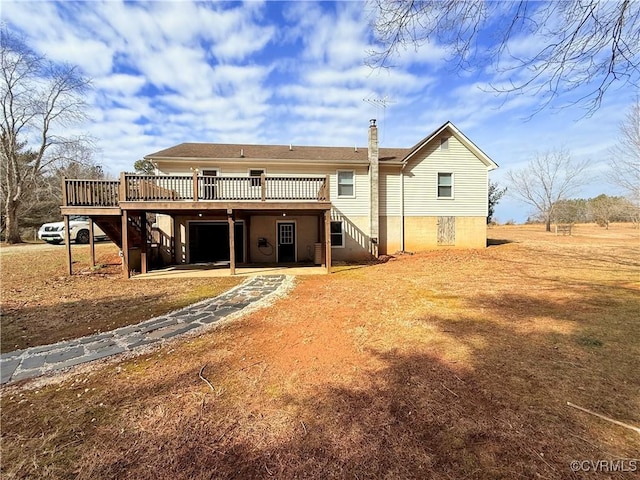 back of property with a wooden deck