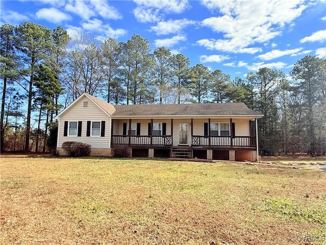 single story home with a front lawn and covered porch