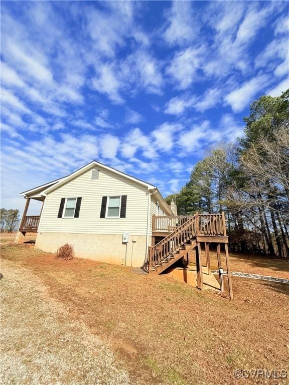 view of side of property with a deck