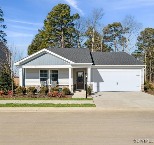 view of front of house with a garage and a porch