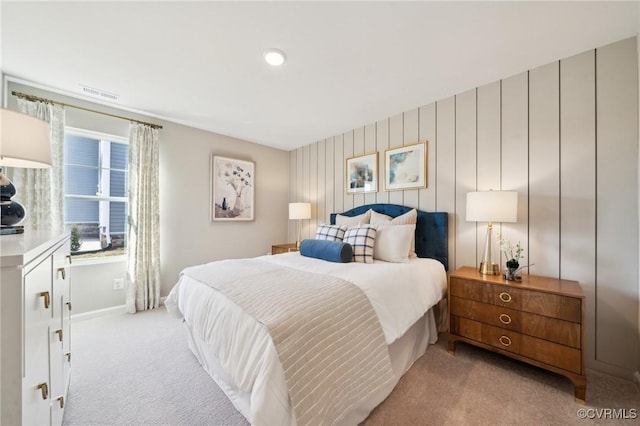 bedroom featuring light carpet