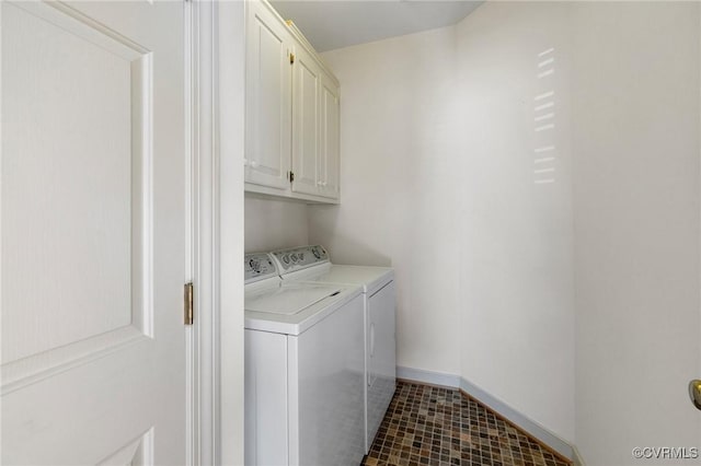 laundry area featuring cabinets and separate washer and dryer