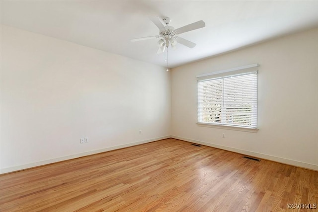 unfurnished room featuring ceiling fan and light hardwood / wood-style floors