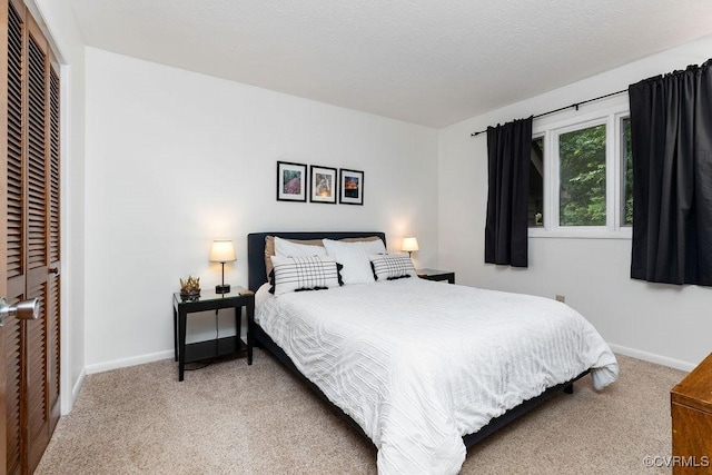 carpeted bedroom featuring a closet