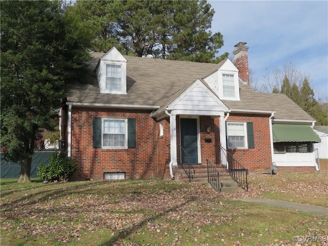 new england style home with a front yard