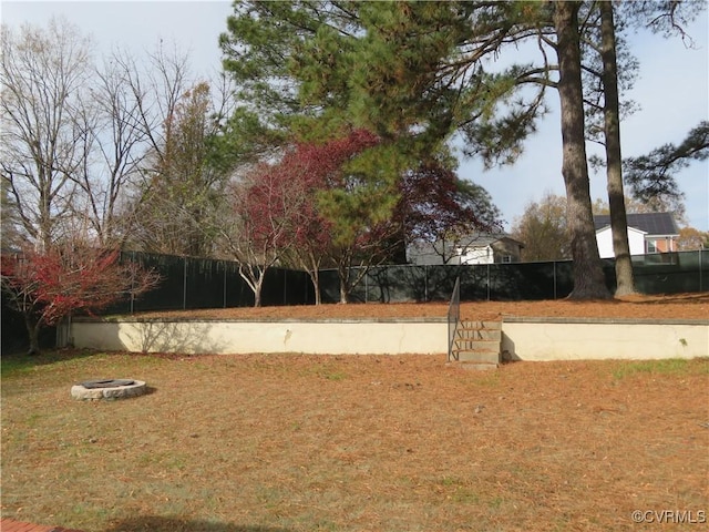 view of yard with an outdoor fire pit