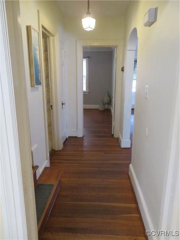 hallway with dark hardwood / wood-style floors