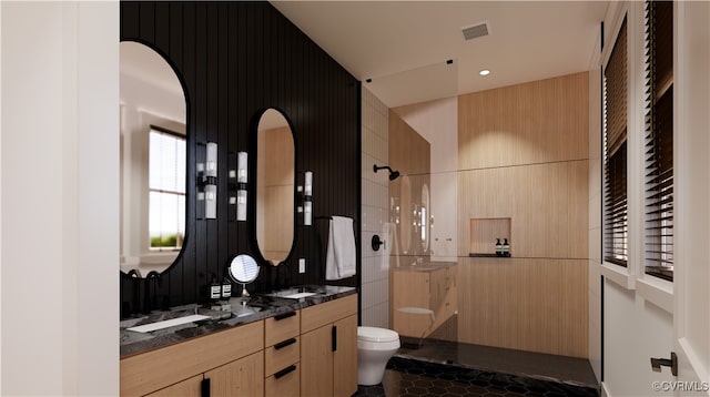 bathroom featuring tile patterned floors, a shower, vanity, and toilet